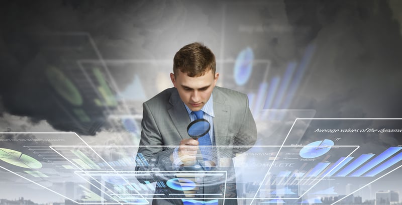 Image of businessman examining objects with magnifier