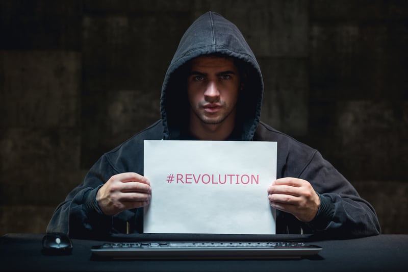 Photo of young hacker and cyber revolution against terrorism