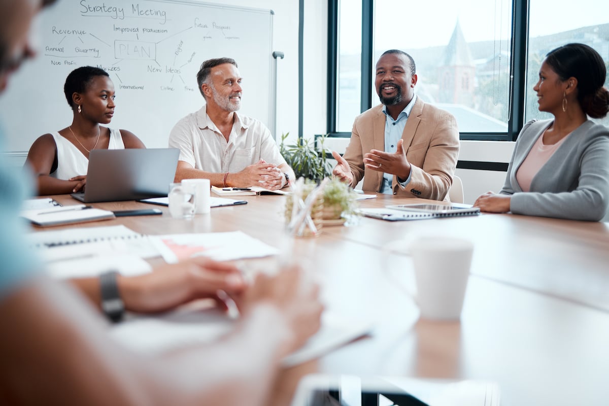 Happy business people, meeting and strategy in planning, team discussion or sharing idea at office
